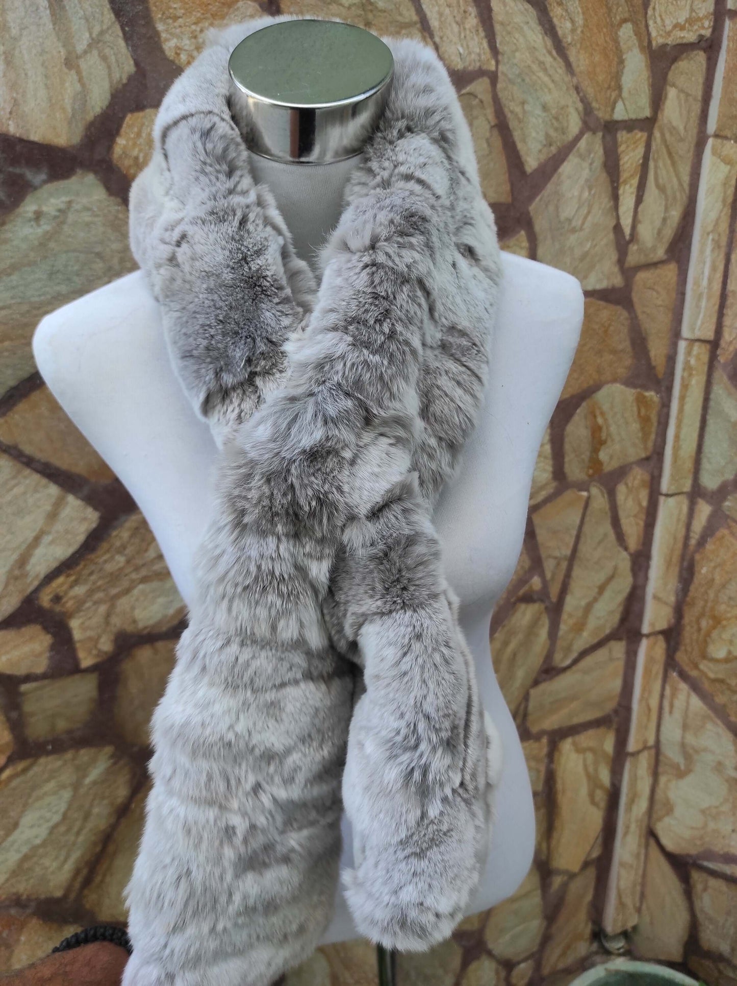 Rex Rabbit Fur Scarf Light Gray - Tatifurs displayed on a mannequin against a textured stone background.