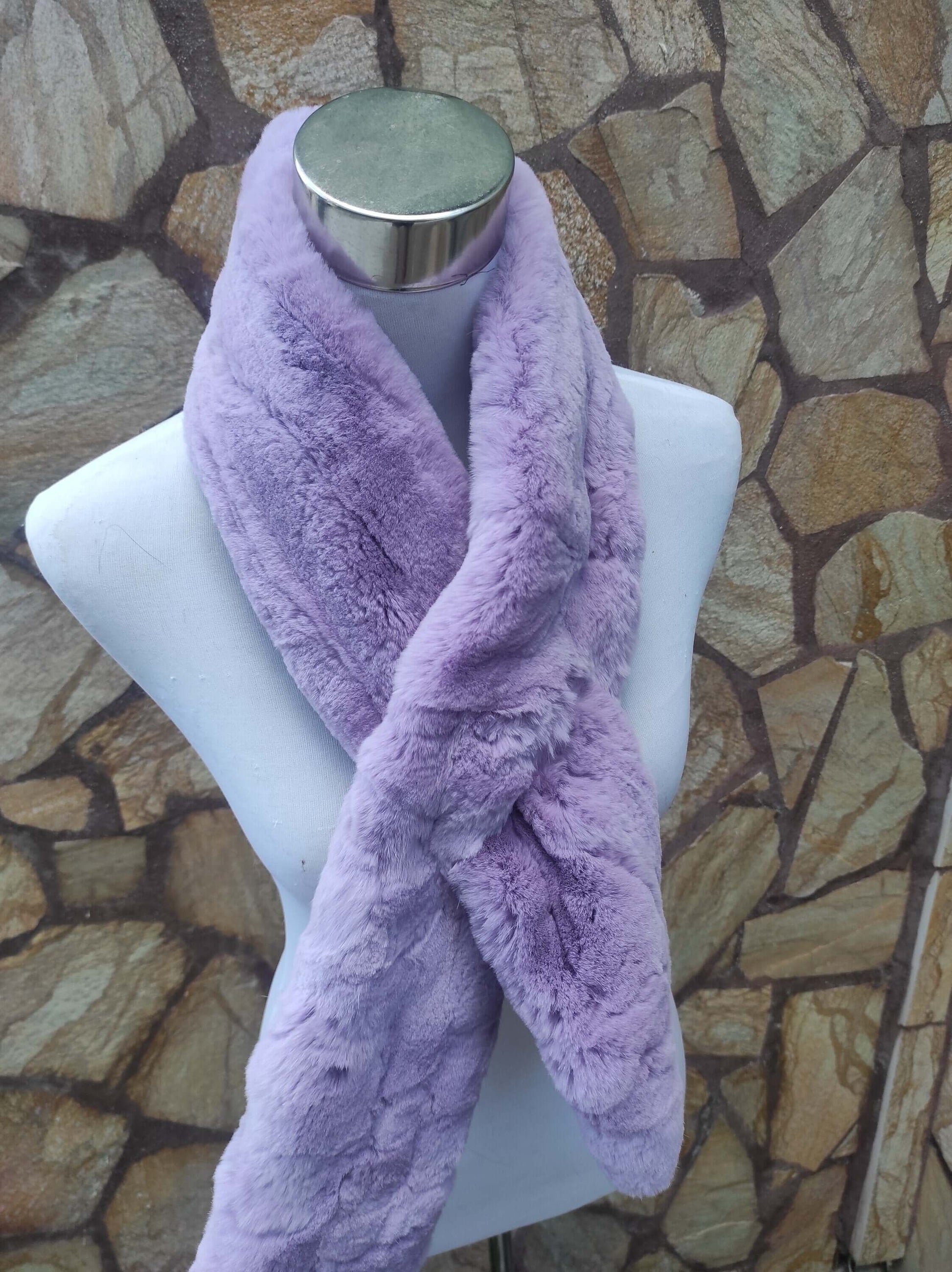 Rex Rabbit Fur Scarf Light Purple - Tatifurs displayed on a mannequin against a stone background.