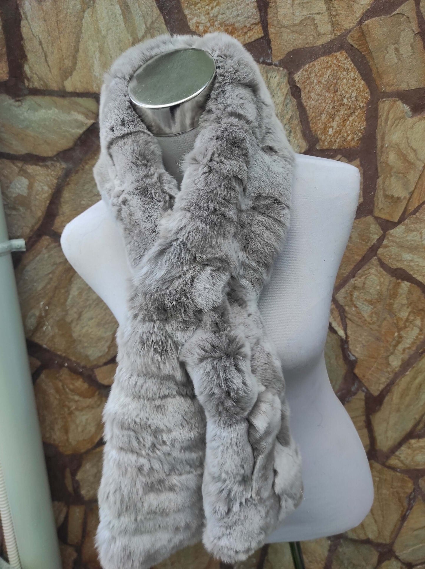 Rex Rabbit Fur Scarf Light Gray - Tatifurs displayed on a mannequin against a stone wall background.