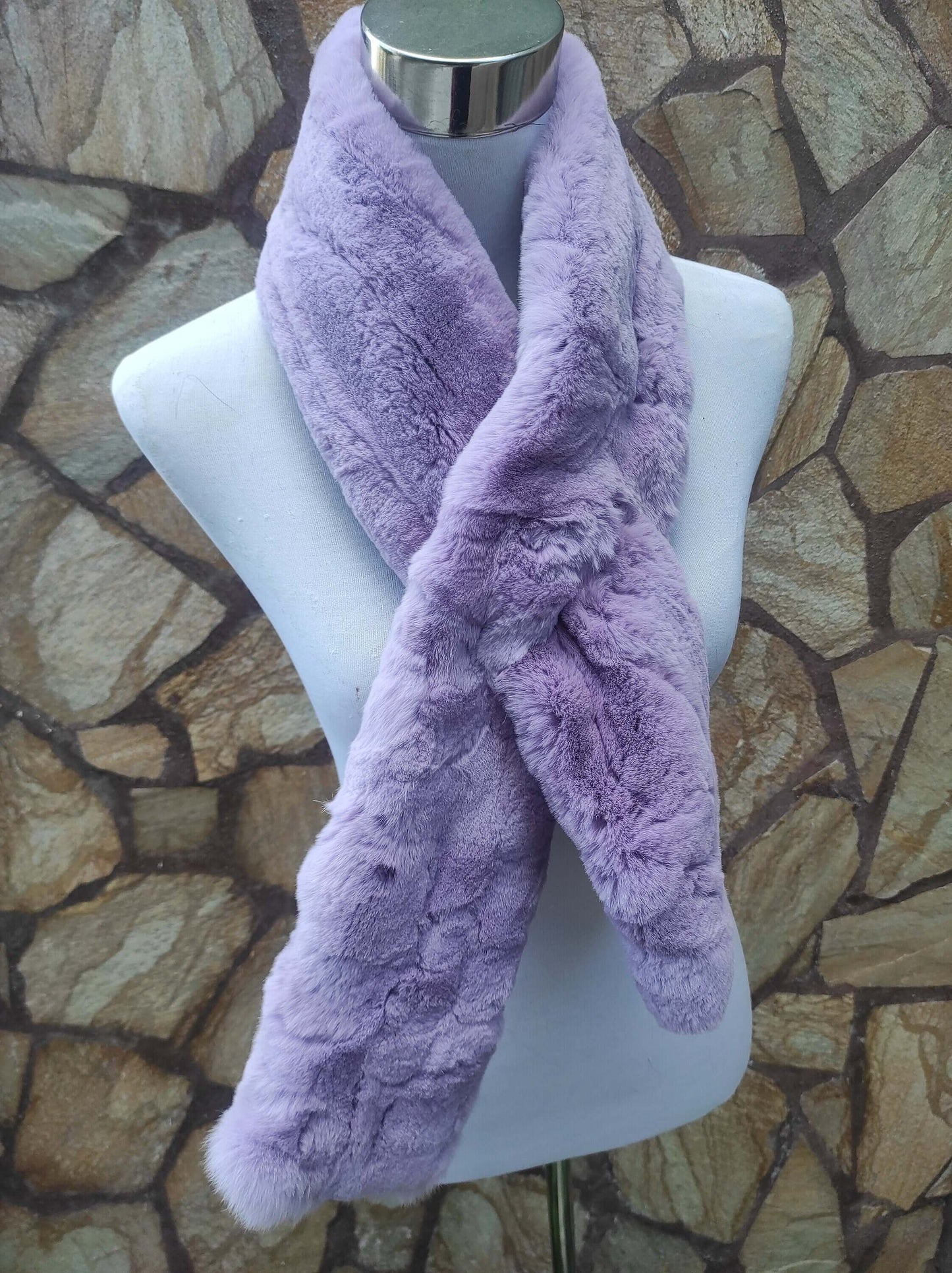 Rex Rabbit Fur Scarf Light Purple - Tatifurs displayed on a mannequin against a stone background.