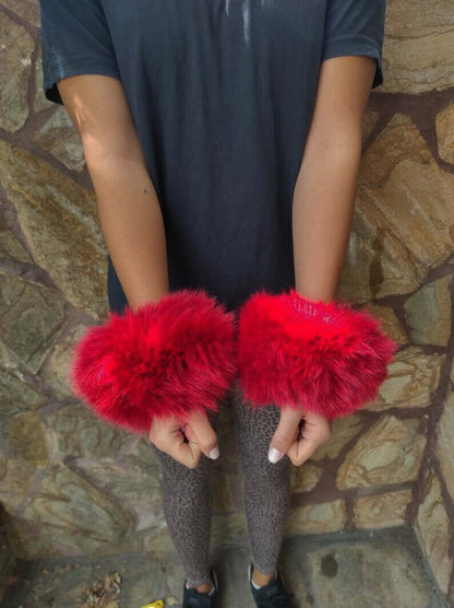 Red Fox Fur Cuffs - Tatifurs worn on wrists, vibrant red fur accessory enhancing style and flair.