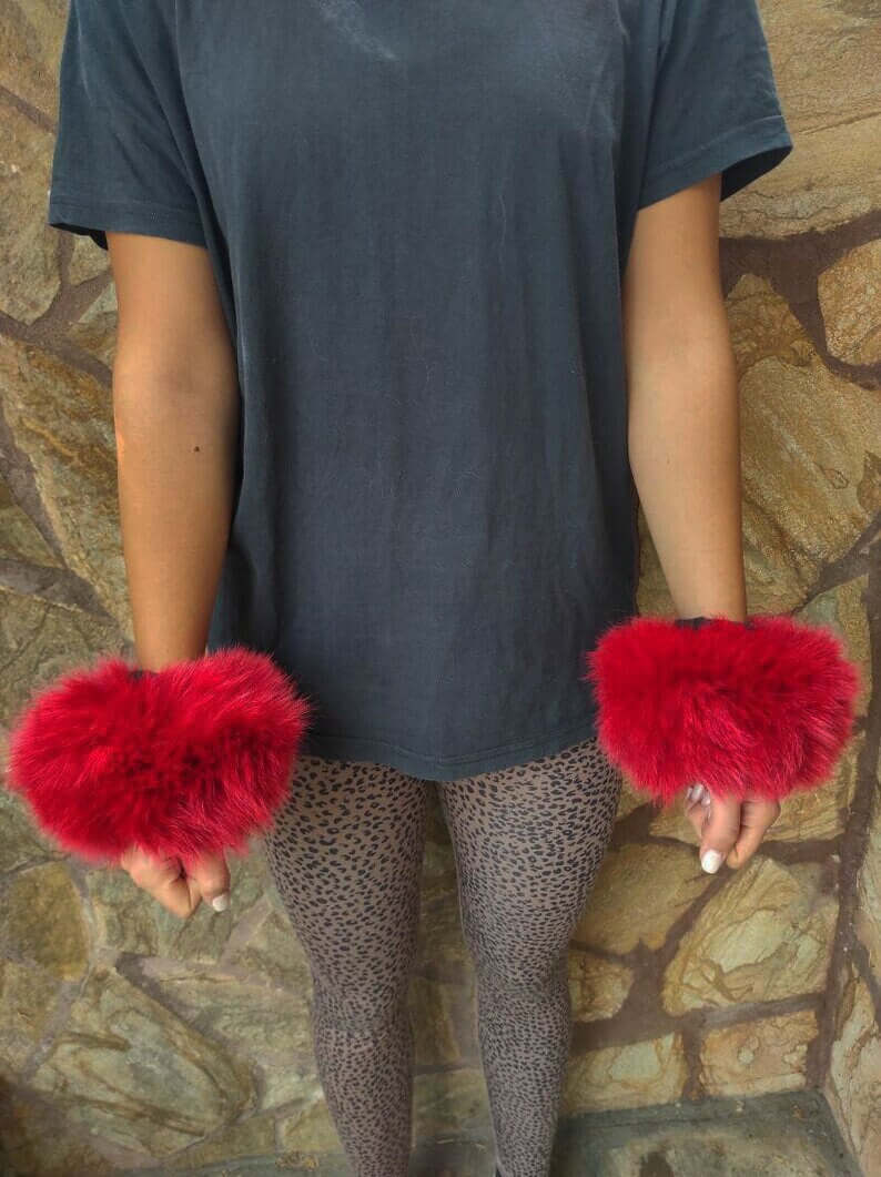 Red Fox Fur Cuffs - Tatifurs displayed on wrists, showcasing vibrant red fox fur with secure velcro closure.