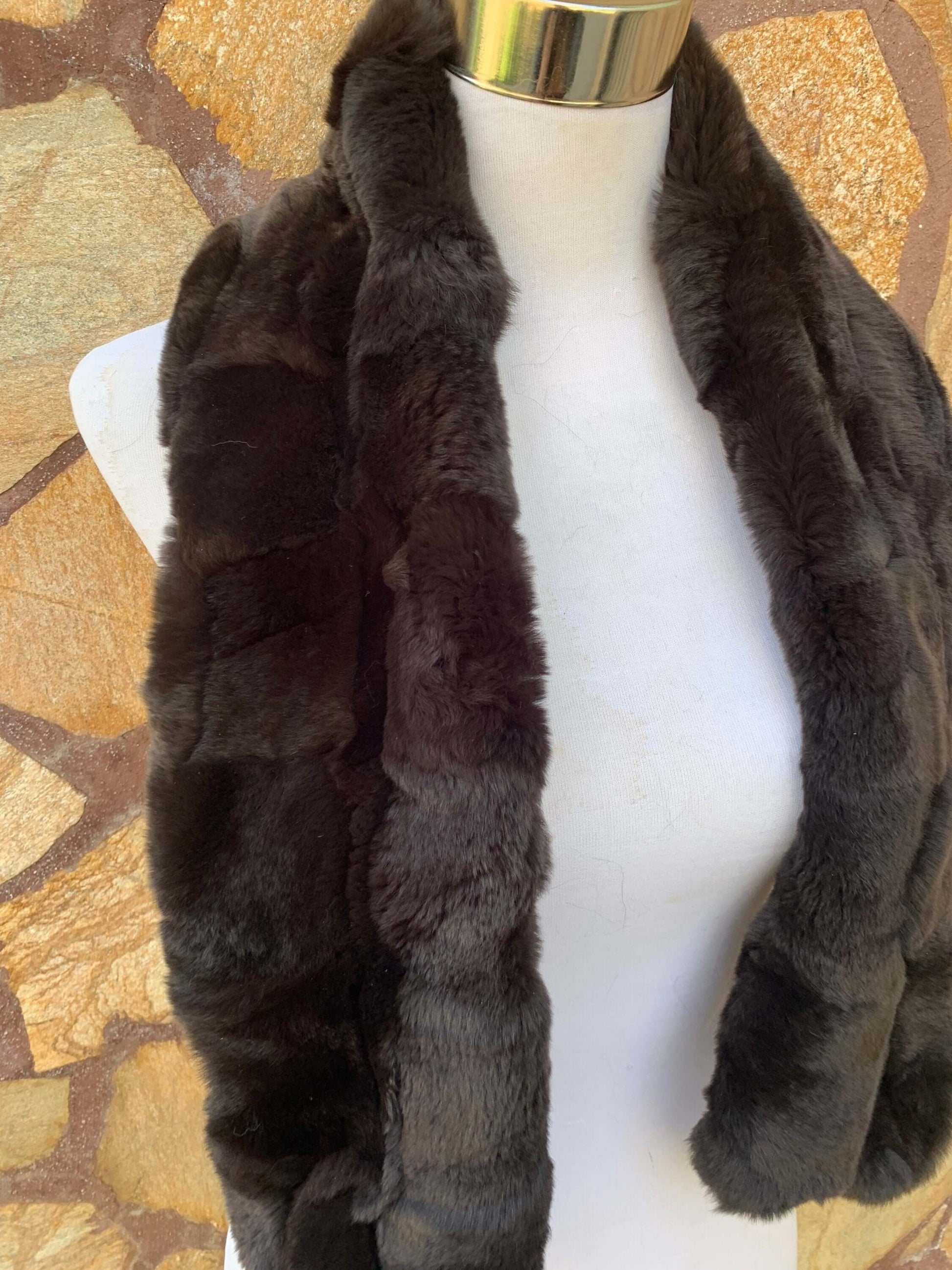 Rex Rabbit Fur Scarf Dark Brown - Tatifurs displayed on a mannequin with a textured background.