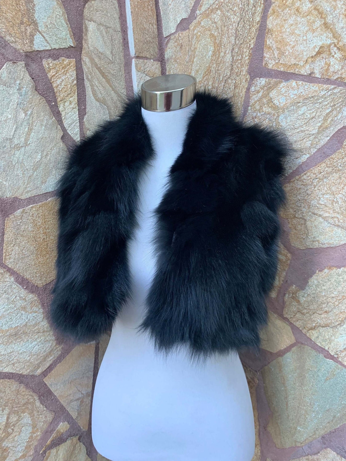 Fox Fur Scarf Black - Tatifurs displayed on a mannequin against a stone wall background.