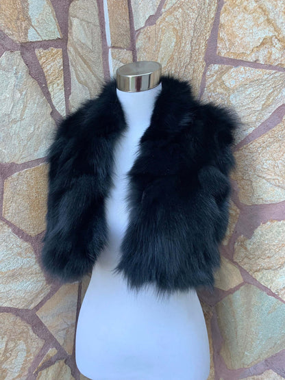 Fox Fur Scarf Black - Tatifurs displayed on a mannequin against a stone wall background.