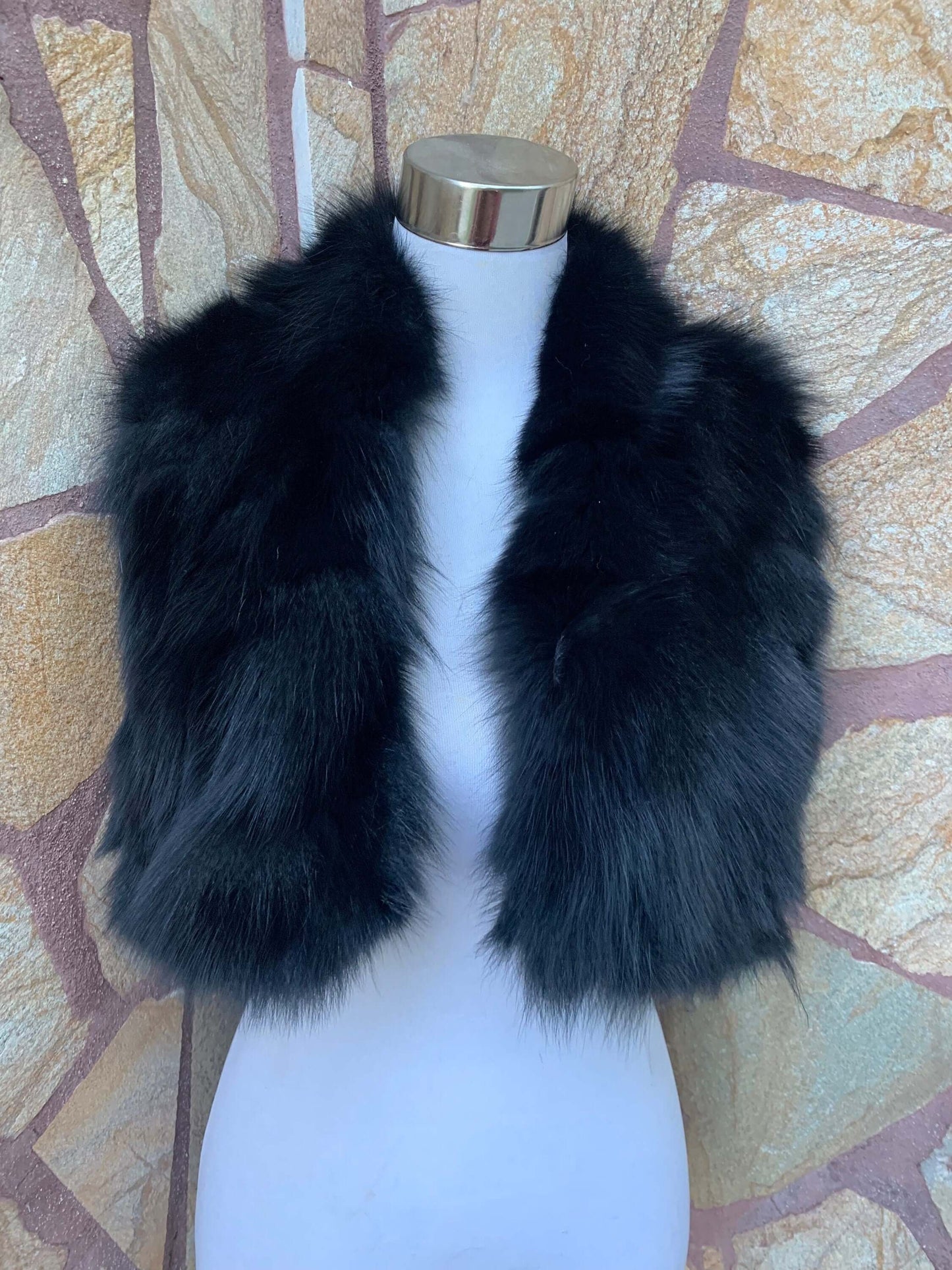 Fox Fur Scarf Black - Tatifurs displayed on a mannequin against a textured stone background.
