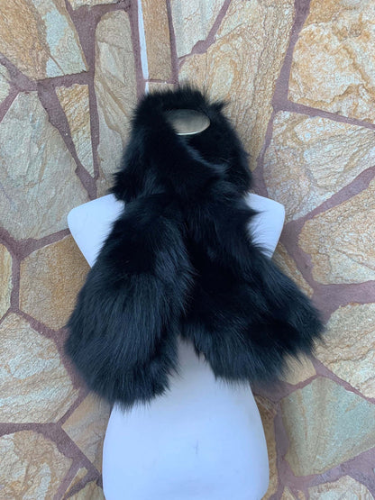 Fox Fur Scarf Black - Tatifurs displayed on a mannequin against a stone background.